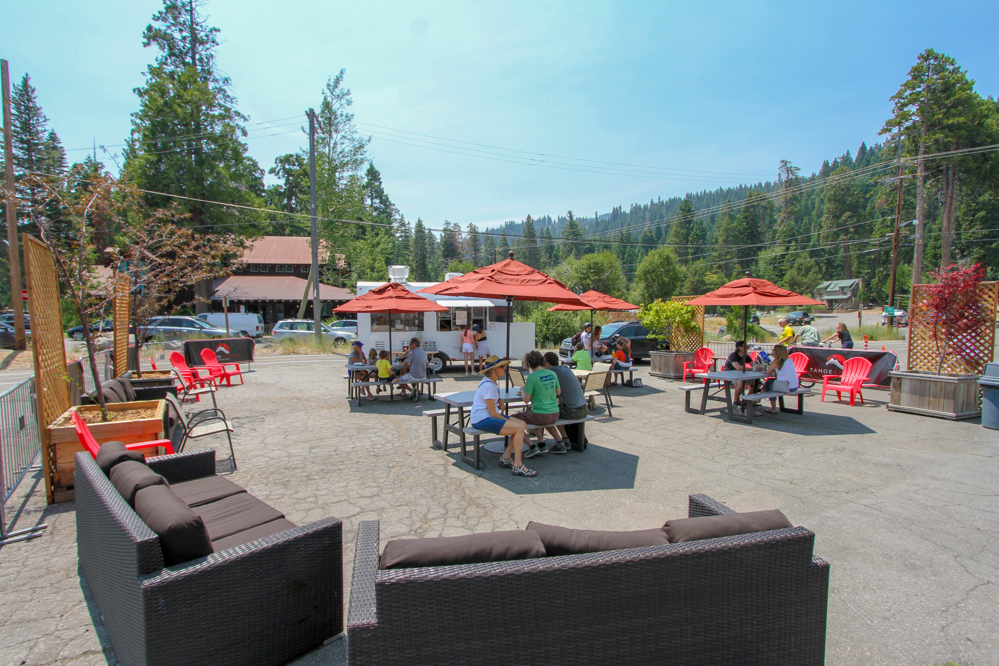 People enjoy lunch in front of the Tahoe Fusion Food Truck.