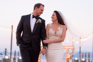 couple walking on pier