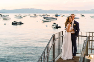 bride and groom with sunset in background