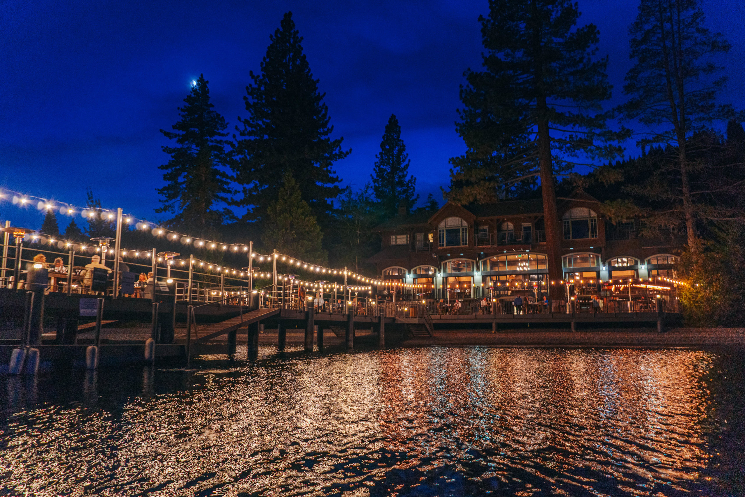 West Shore Cafe at night looking at patio from boat