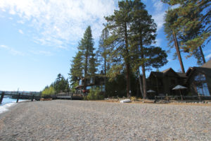 A view from the beach looking towards the West Shore Cafe Pier and Inn
