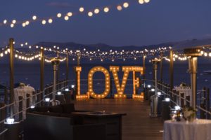 Pier with lit up love sign